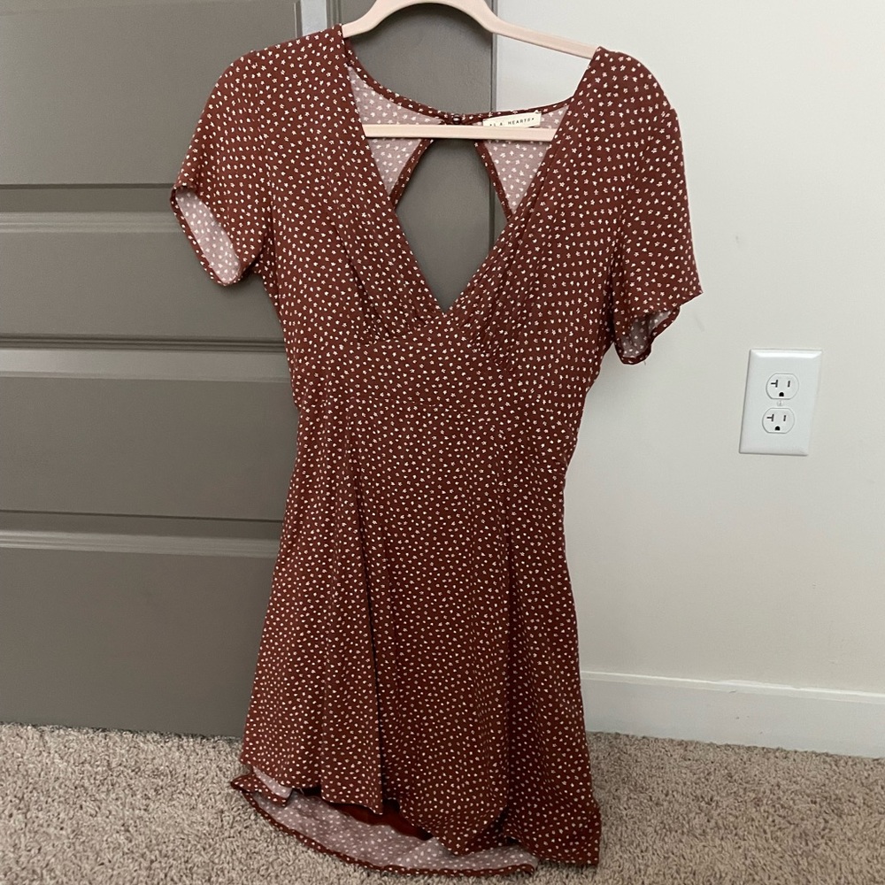 Brown/white floral mini dress (size small) open back with tie-closure.